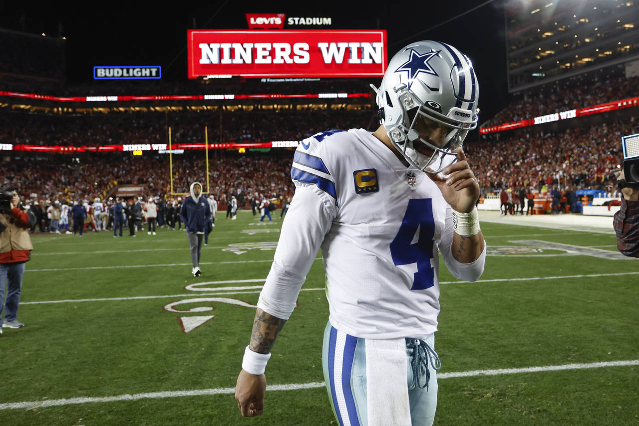 Dallas Cowboys quarterback Dak Prescott (4) walks off the field after an NFL divisional round playo...
