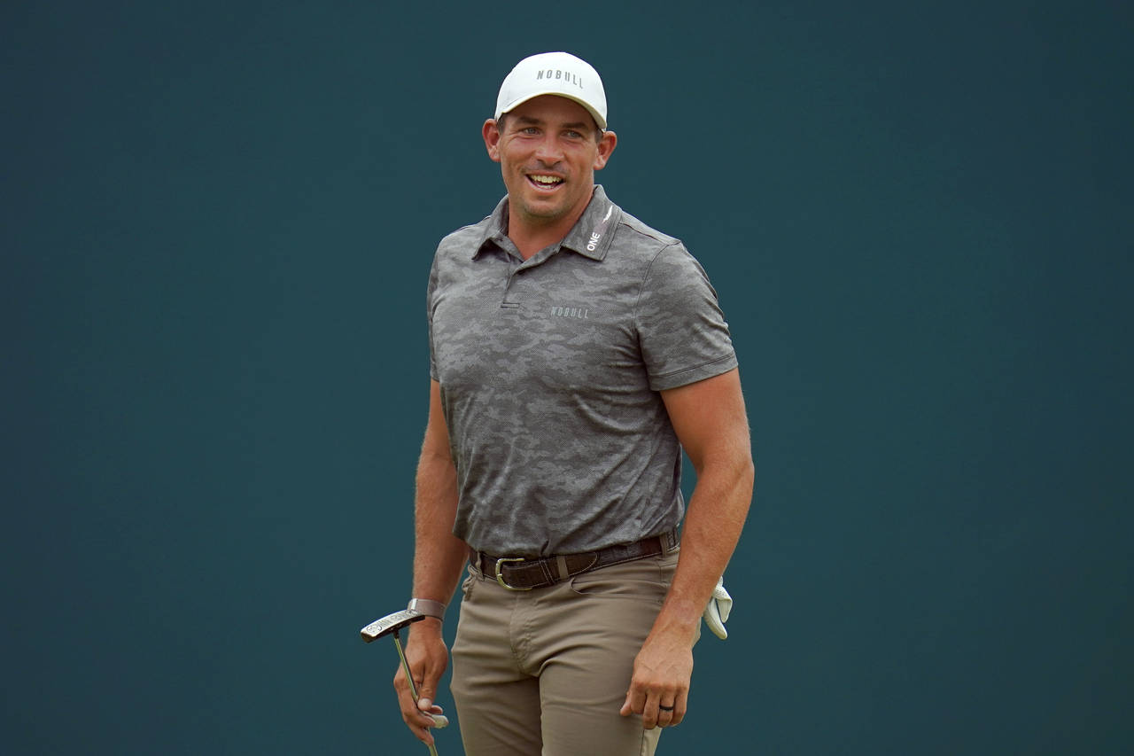 FILE - Scott Stallings reacts to a shot by Adam Scott, of Australia, on the 18th green during the f...