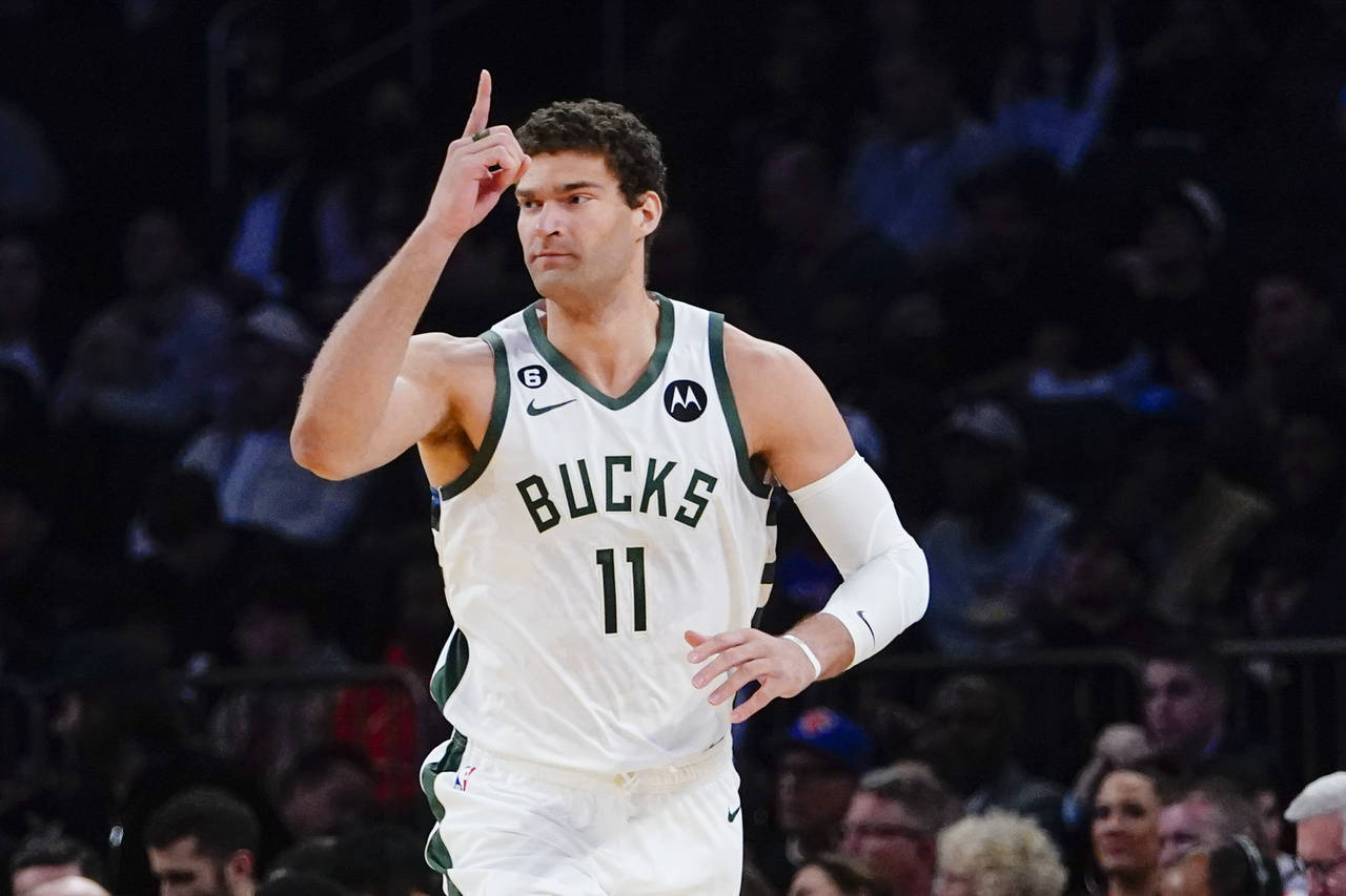 Milwaukee Bucks' Brook Lopez (11) gestures after making a 3-point basket during the first half of a...
