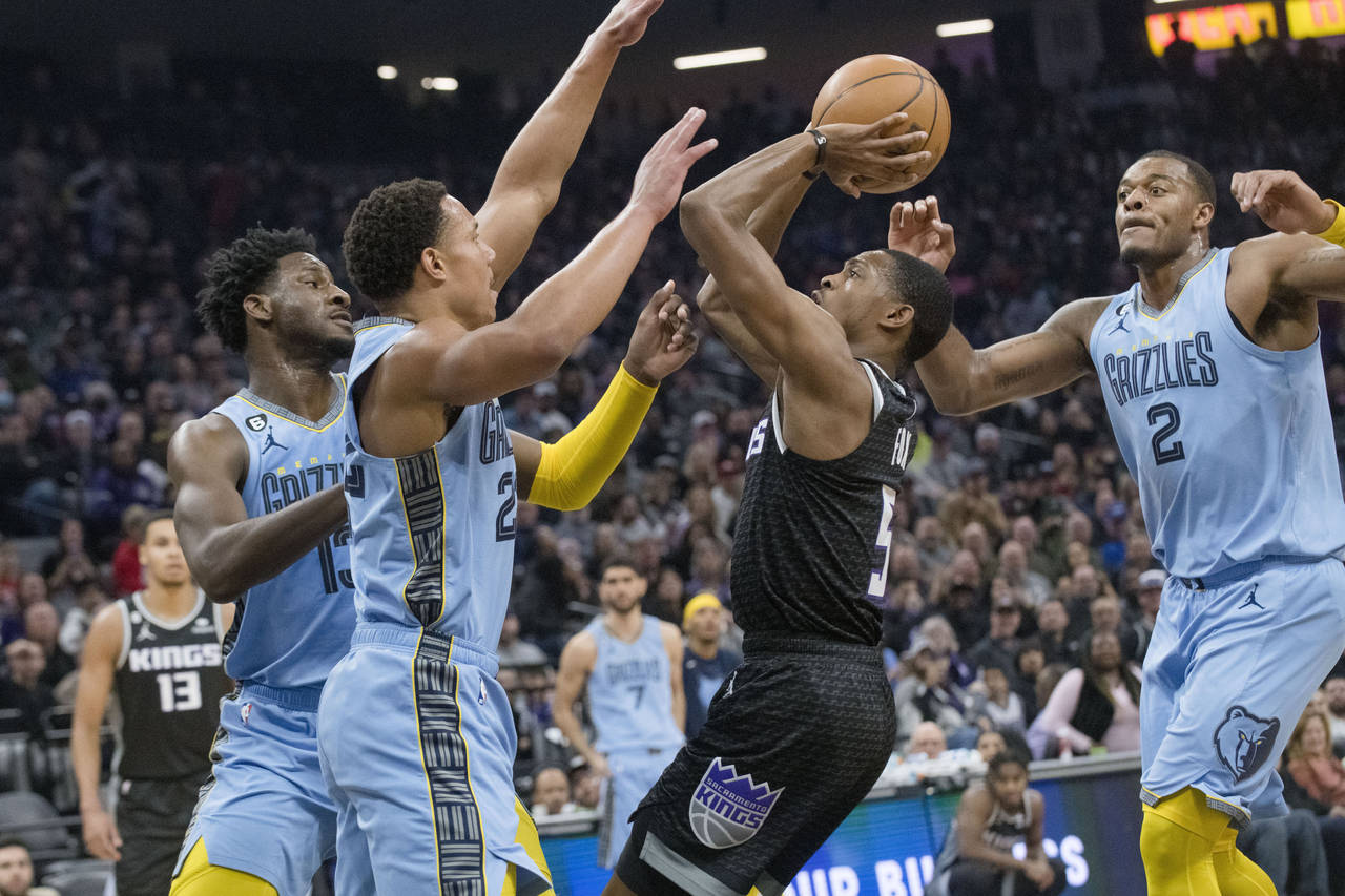Memphis Grizzlies forward Jaren Jackson Jr., left, and Desmond Bane, second from left, guard agains...