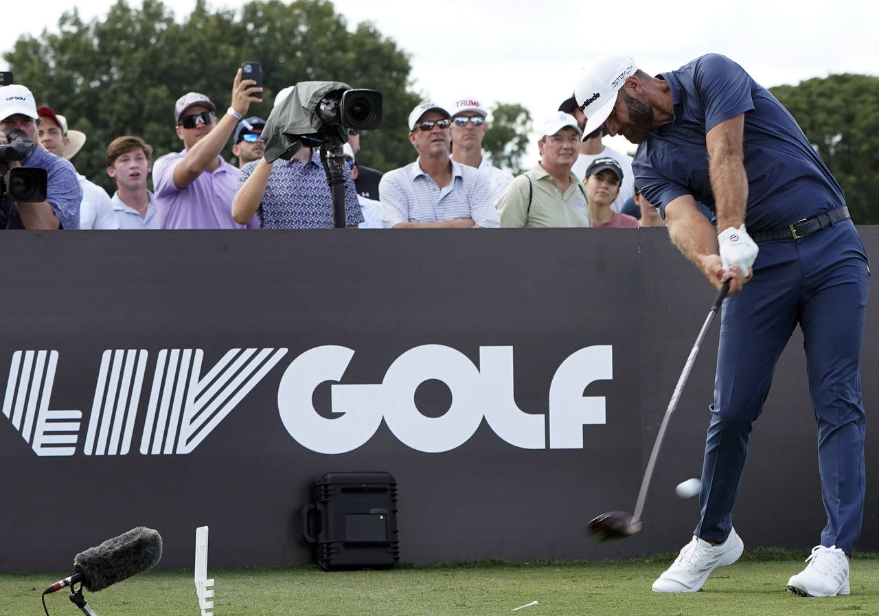 FILE - Dustin Johnson hits from the third tee during the second round of the LIV Golf Team Champion...