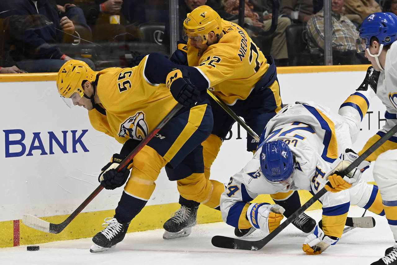 Nashville Predators defenseman Roland McKeown (55) gets control of the puck in front of right wing ...