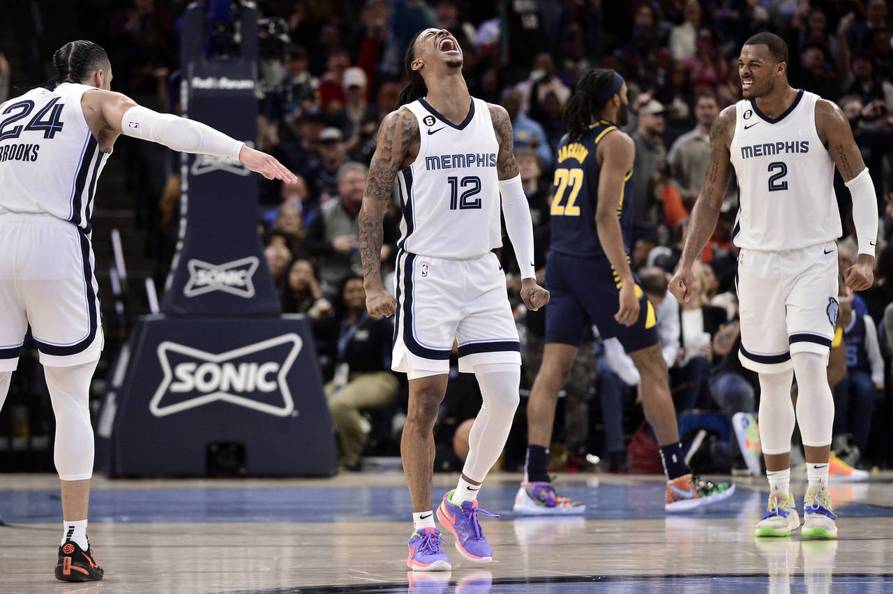 Memphis Grizzlies guard Ja Morant (12) reacts in the second half of an NBA basketball game against ...