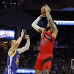 Curry's 35 points send Warriors past Raptors, 129-117