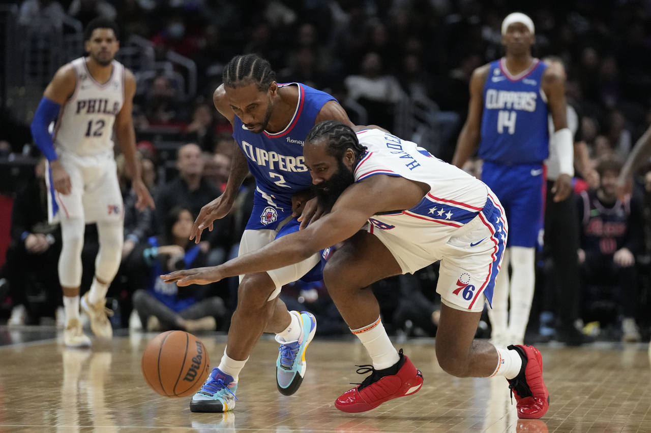 Los Angeles Clippers forward Kawhi Leonard (2) and Philadelphia 76ers guard James Harden (1) reach ...