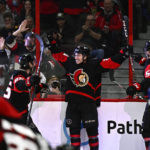 Lucchini scores 1st, Senators end Sabres' 6-game win streak