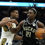 Holiday sparks late rally as Bucks beat Pacers 132-119