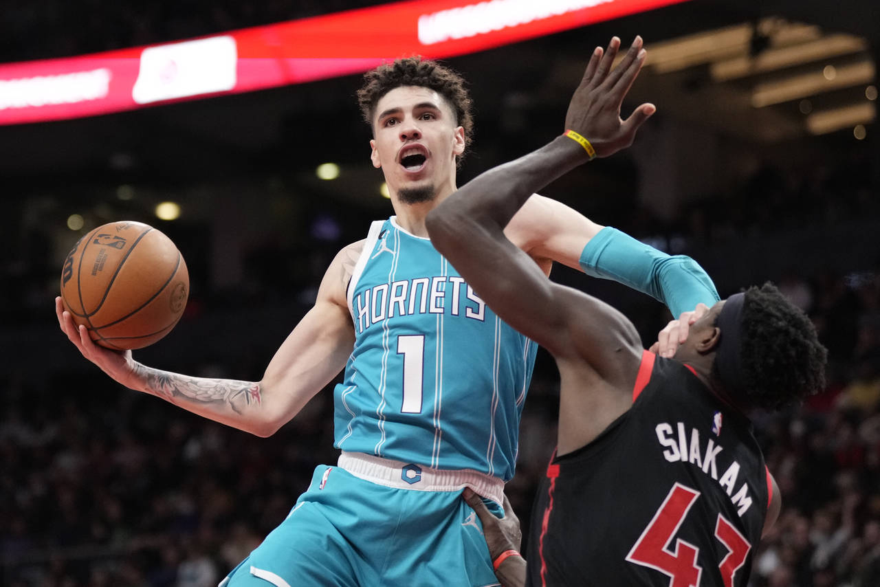 Charlotte Hornets guard LaMelo Ball (1) is called for an offensive foul as gets his hand up on Toro...