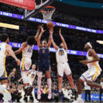 Curry, Poole lead Warriors to 127-118 win against Wizards