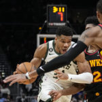 Holiday, Lopez help Bucks hold off Hawks, 114-105