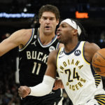 Holiday sparks late rally as Bucks beat Pacers 132-119