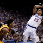 Adams scores late, No. 2 Kansas edges No. 14 Iowa St 62-60