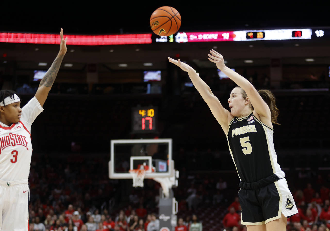 Purdue guard Cassidy Hardin, right, shoots in front of Ohio State guard Hevynne Bristow during the ...