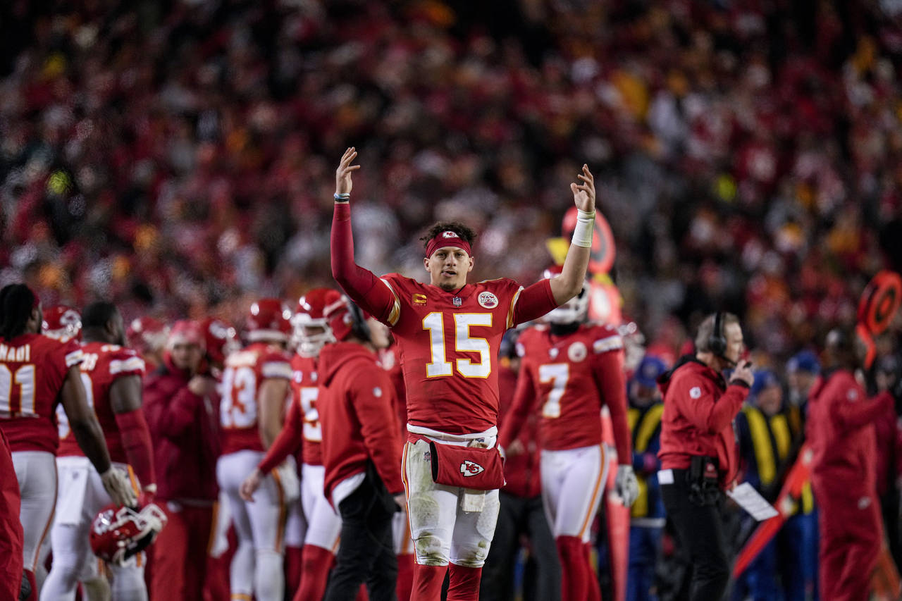Kansas City Chiefs quarterback Patrick Mahomes (15) cheers during the second half of an NFL divisio...