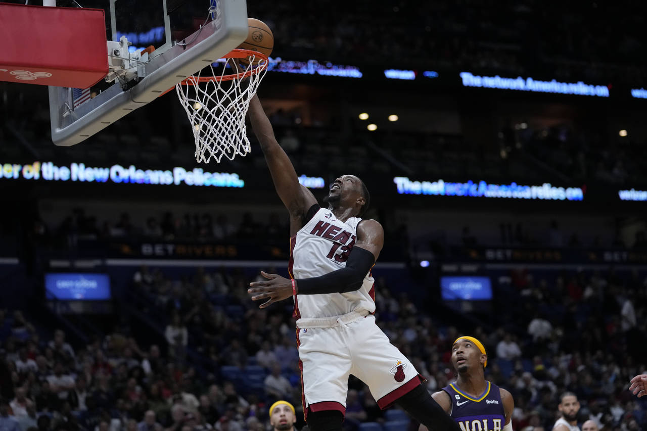 Miami Heat center Bam Adebayo (13) goes to the basket in the second half of an NBA basketball game ...