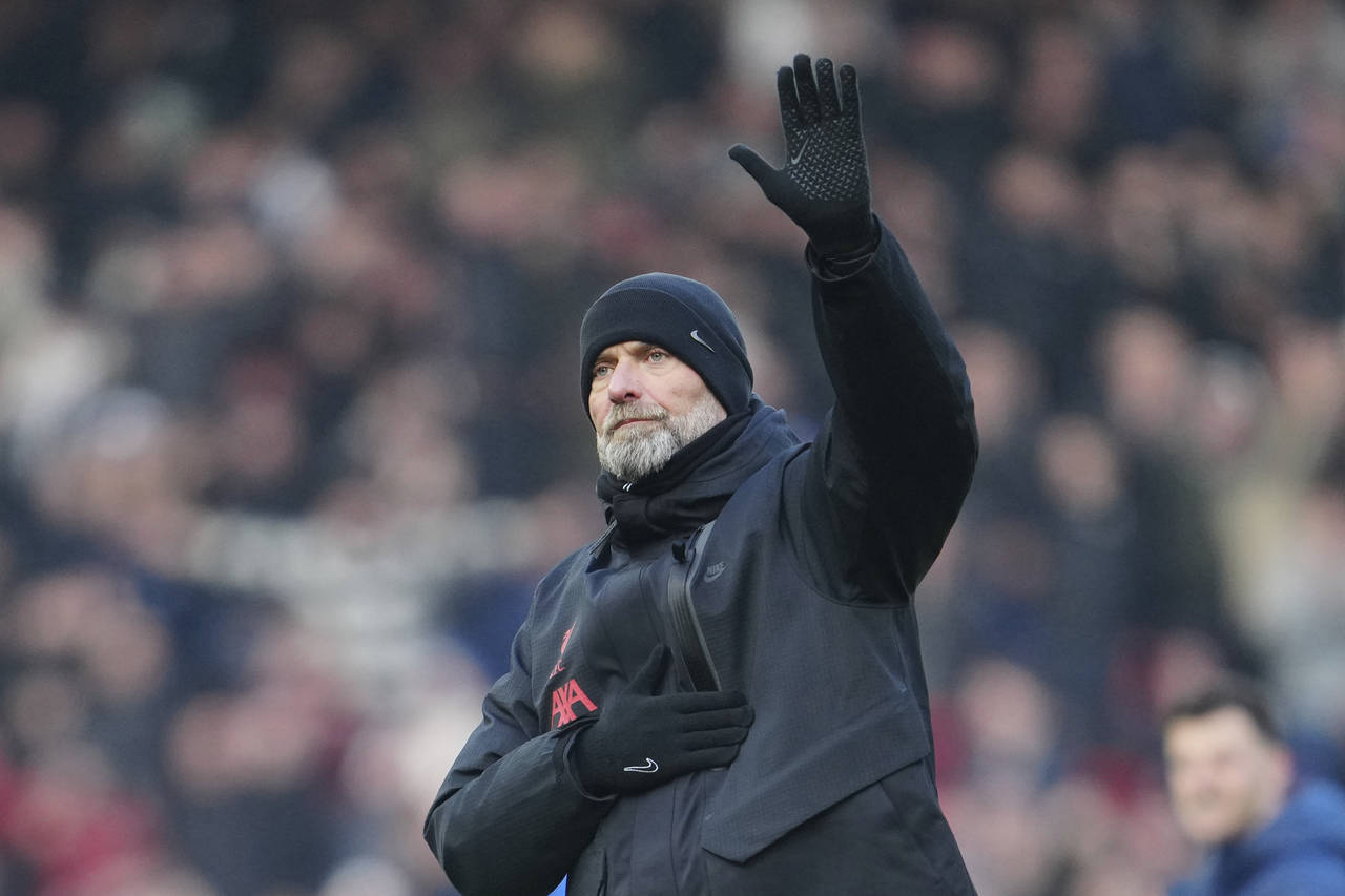 Liverpool's manager Jurgen Klopp waves after the English Premier League soccer match between Liverp...