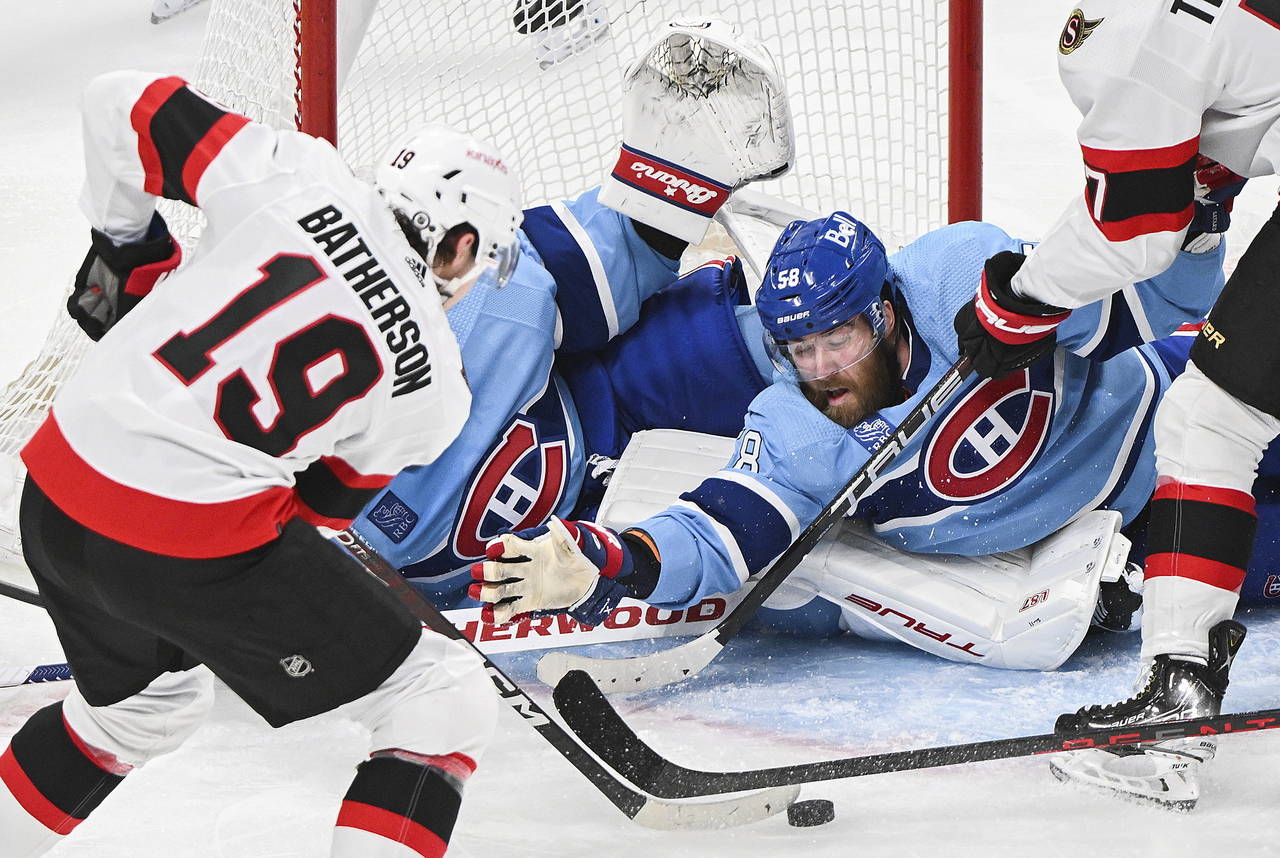 Ottawa Senators Drake Batherson (19) moves in on Montreal Canadiens' goaltender Jake Allen as Canad...
