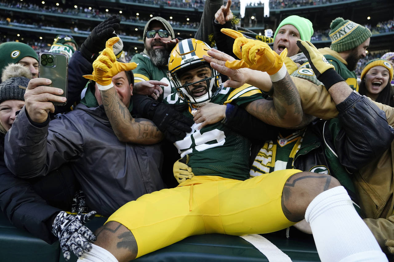 Green Bay Packers cornerback Keisean Nixon (25) celebrates with fans after returning a kickoff for ...