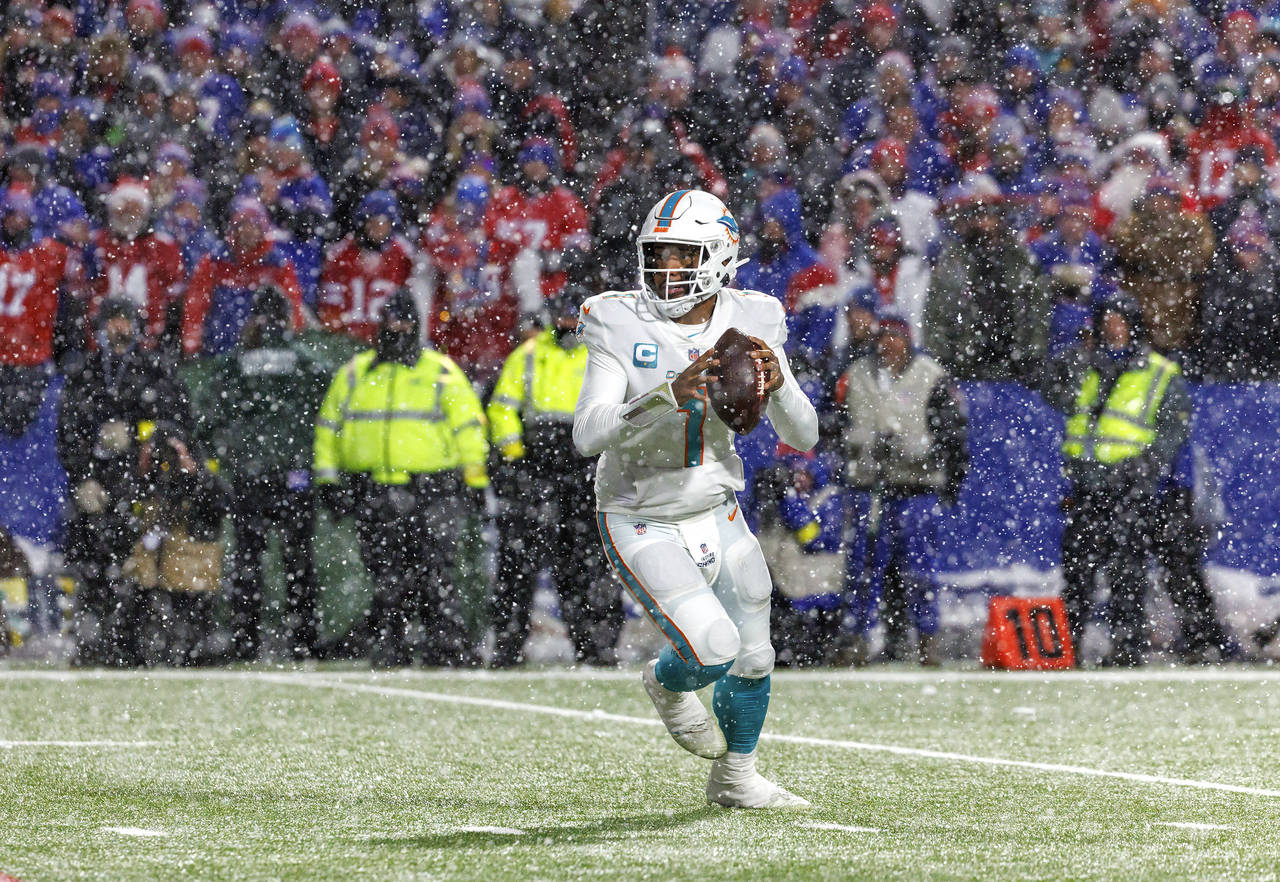 Miami Dolphins quarterback Tua Tagovailoa (1) sets up to pass during fourth quarter of an NFL footb...
