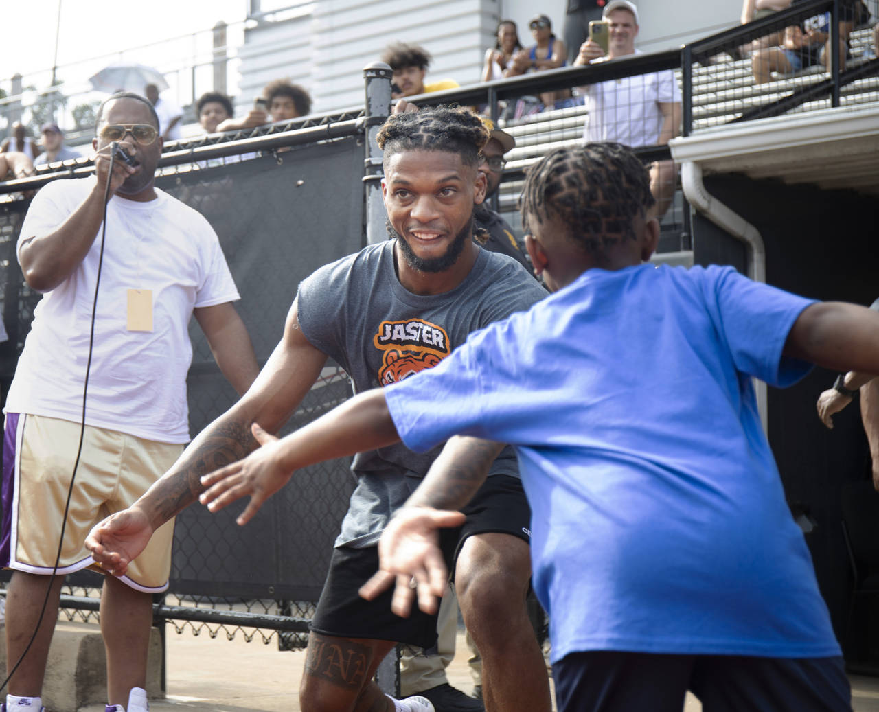 FILE - Buffalo Bills' Damar Hamlin high fives his little brother Damir Hamlin, 7, during a celebrit...