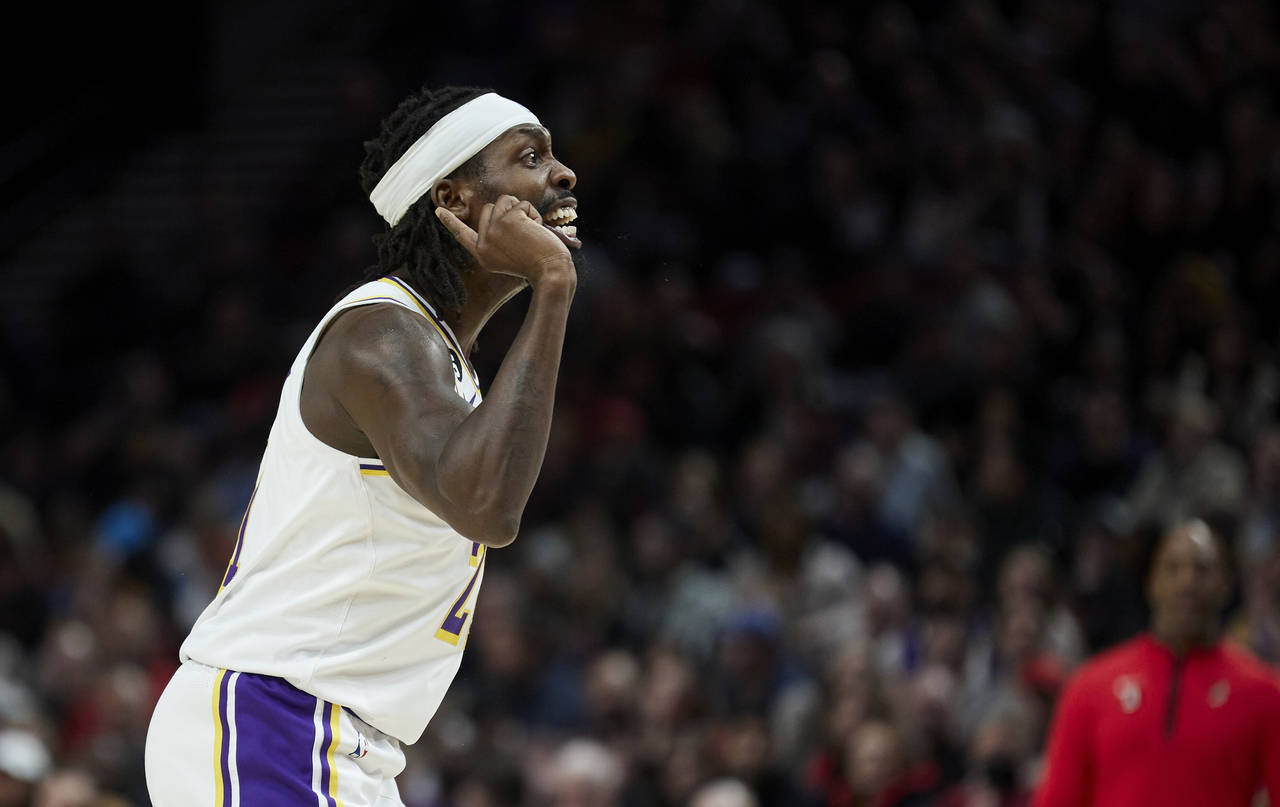 Los Angeles Lakers guard Patrick Beverley reacts after scoring against the Portland Trail Blazers d...