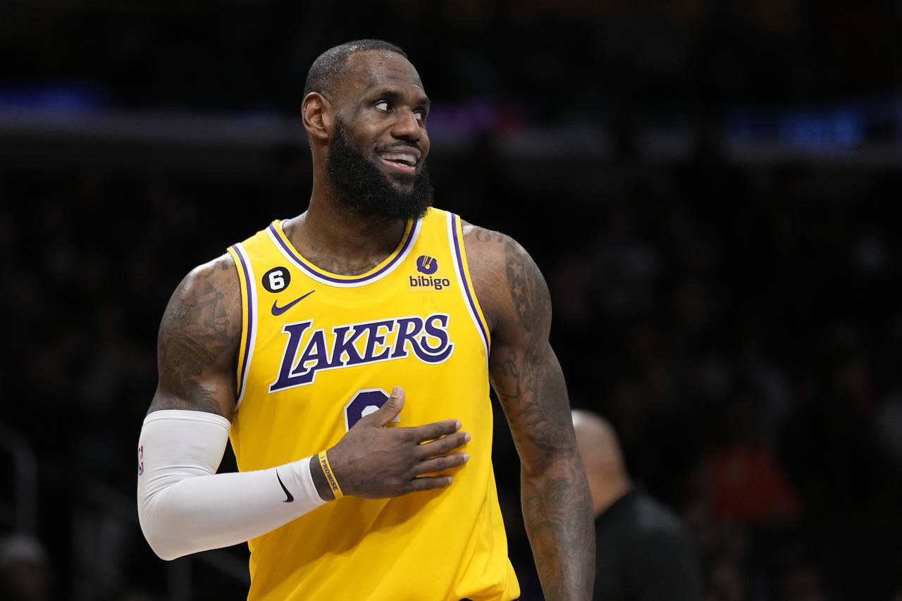 Los Angeles Lakers forward LeBron James smiles during the second half of an NBA basketball game aga...