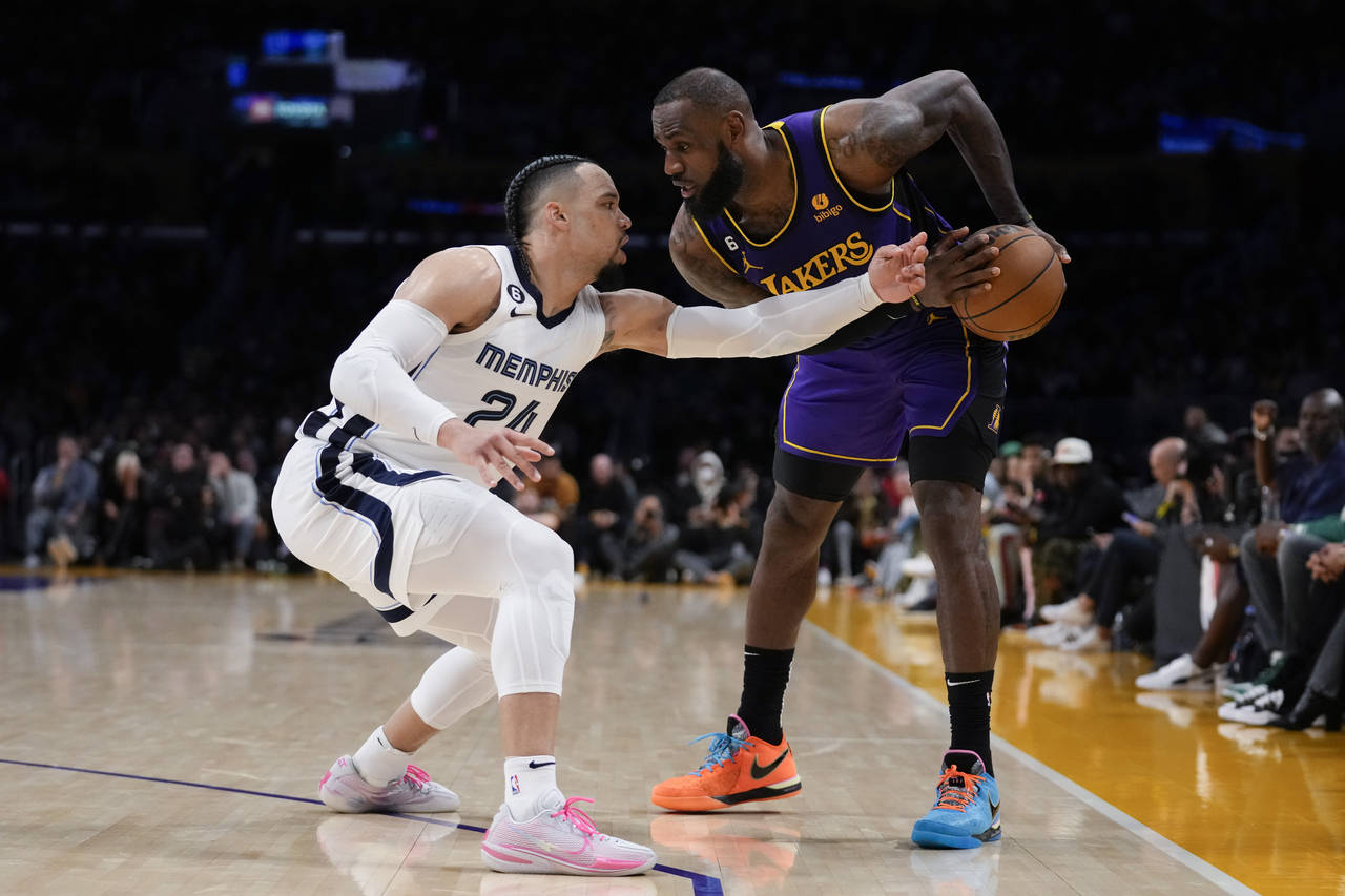 Memphis Grizzlies forward Dillon Brooks (24) defends against Los Angeles Lakers forward LeBron Jame...