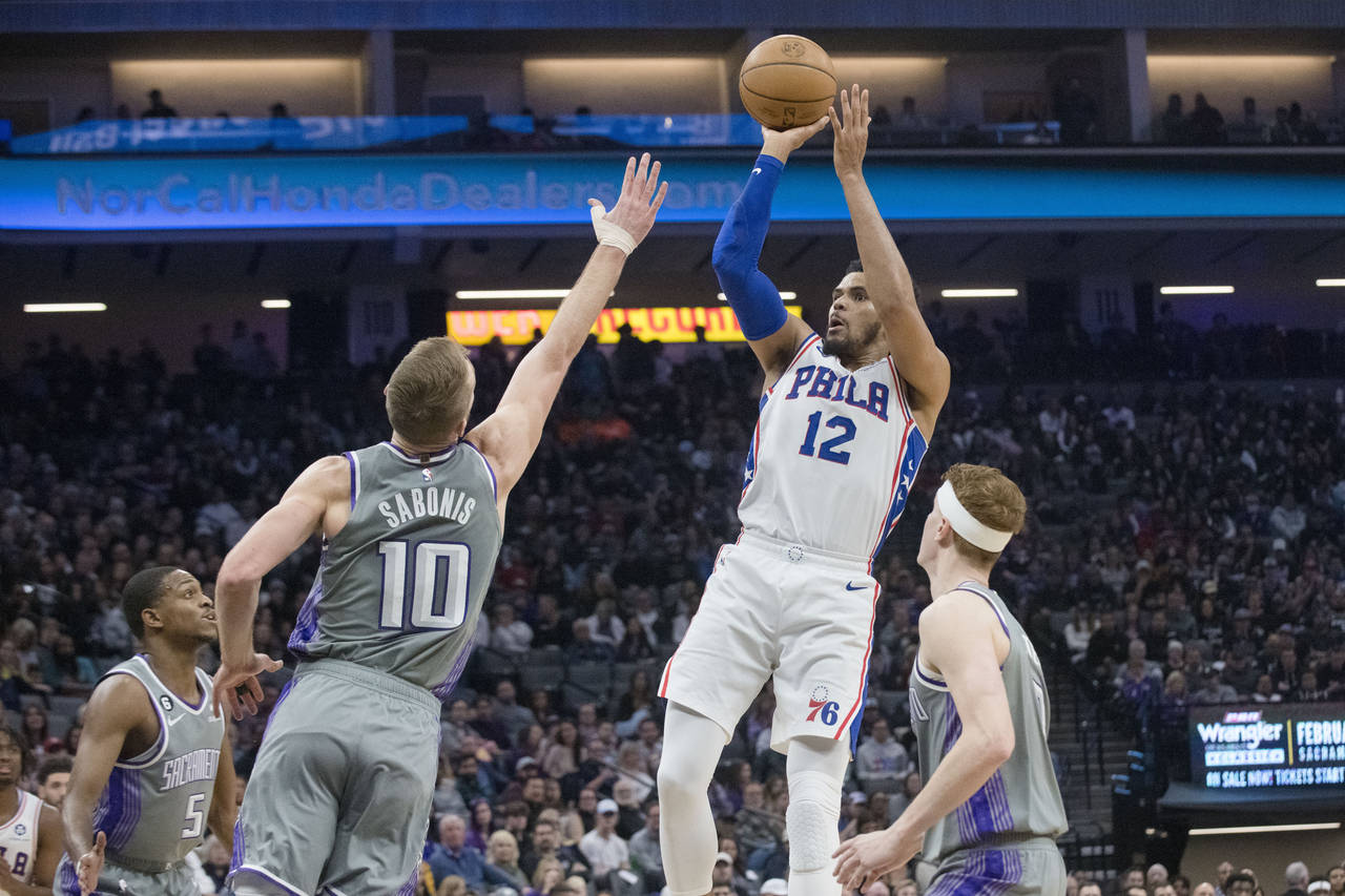 Philadelphia 76ers forward Tobias Harris (12) shoots over Sacramento Kings forward Domantas Sabonis...