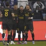Bruised Ronaldo scores twice to edge showdown with Messi