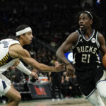 Holiday sparks late rally as Bucks beat Pacers 132-119