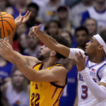 Adams scores late, No. 2 Kansas edges No. 14 Iowa St 62-60