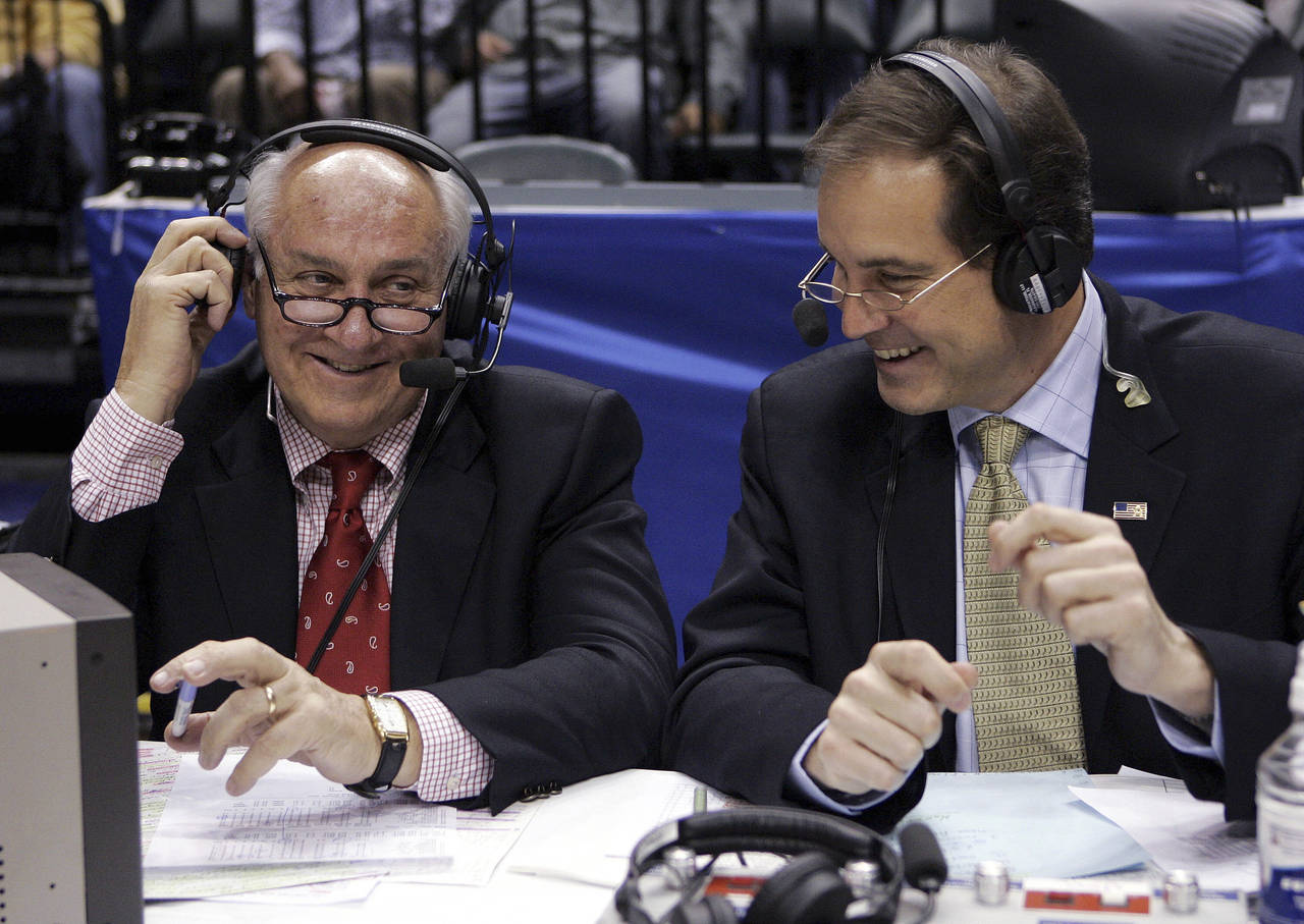 FILE - CBS announcers Billy Packer, left, and Jim Nantz laugh during a break in the championship ga...