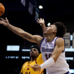Adams scores late, No. 2 Kansas edges No. 14 Iowa St 62-60
