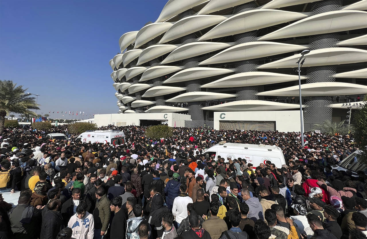 Iraqi soccer fans try to enter the Basra International Stadium in Basra, Iraq, Thursday, Jan 19, 20...