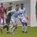 Bruised Ronaldo scores twice to edge showdown with Messi