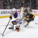 Oilers beat reeling Canucks 4-2 for 6th straight victory.
