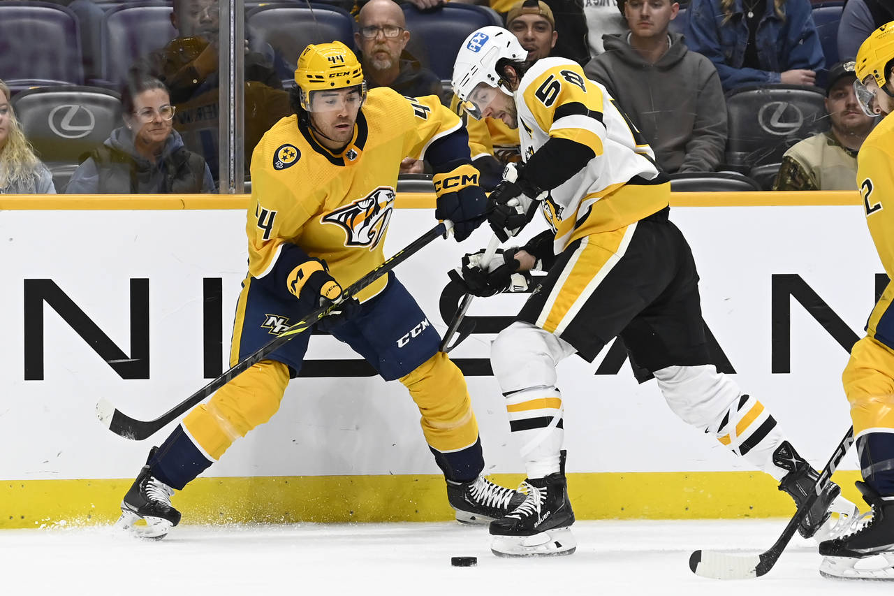 Nashville Predators right wing Kiefer Sherwood (44) and Pittsburgh Penguins defenseman Kris Letang ...