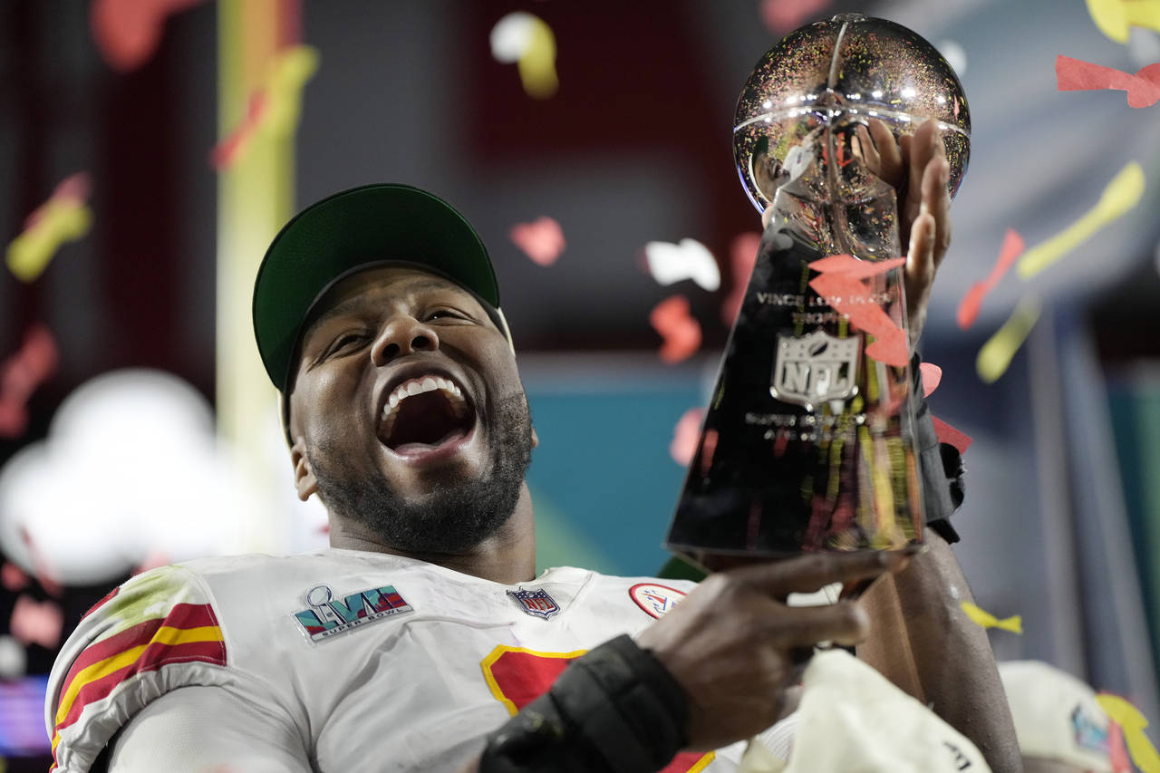 Kansas City Chiefs defensive end Carlos Dunlap celebrates with the Vince Lombardi Trophy after the ...
