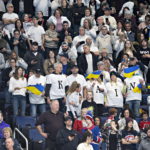 Ukrainians, Bruins celebrate unity arm-in-arm on the ice