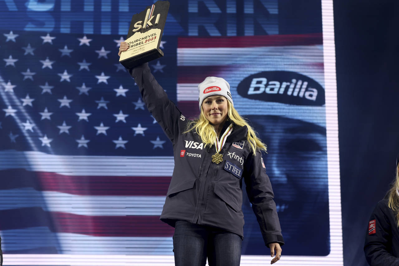 United States' Mikaela Shiffrin poses with the gold medal of the women's World Championship giant s...