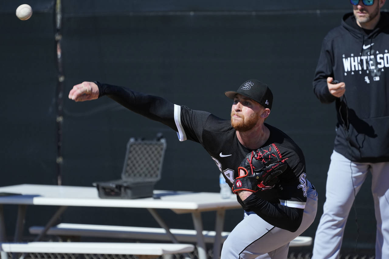 Chicago White Sox starting pitcher Michael Kopech works out during a spring training baseball pract...