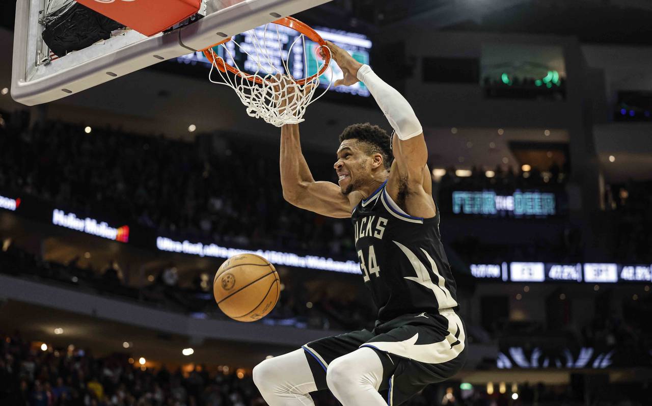 Milwaukee Bucks forward Giannis Antetokounmpo (34) dunks against the Boston Celtics during an NBA b...