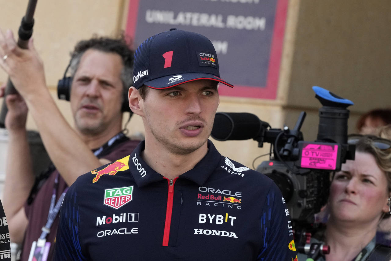 Red Bull driver Max Verstappen of the Netherlands arrives at the paddock during a Formula One pre s...