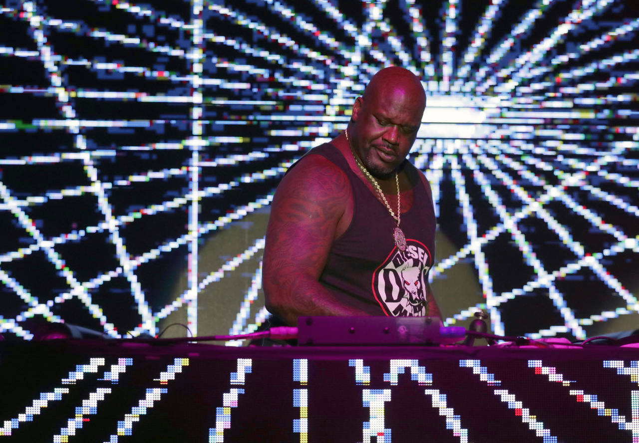 FILE - Former NBA basketball player Shaquille O' Neal, who moonlights as DJ Diesel, appears at Shaq...