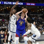 Morant scores 23, Grizzlies rout Nuggets in West showdown