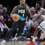 Lillard has triple-double, Blazers rally late past Warriors