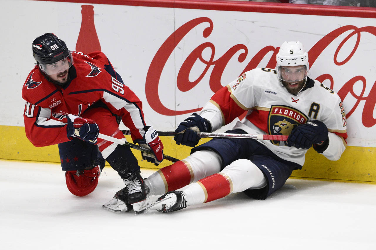 Washington Capitals left wing Marcus Johansson (90) and Florida Panthers defenseman Aaron Ekblad (5...