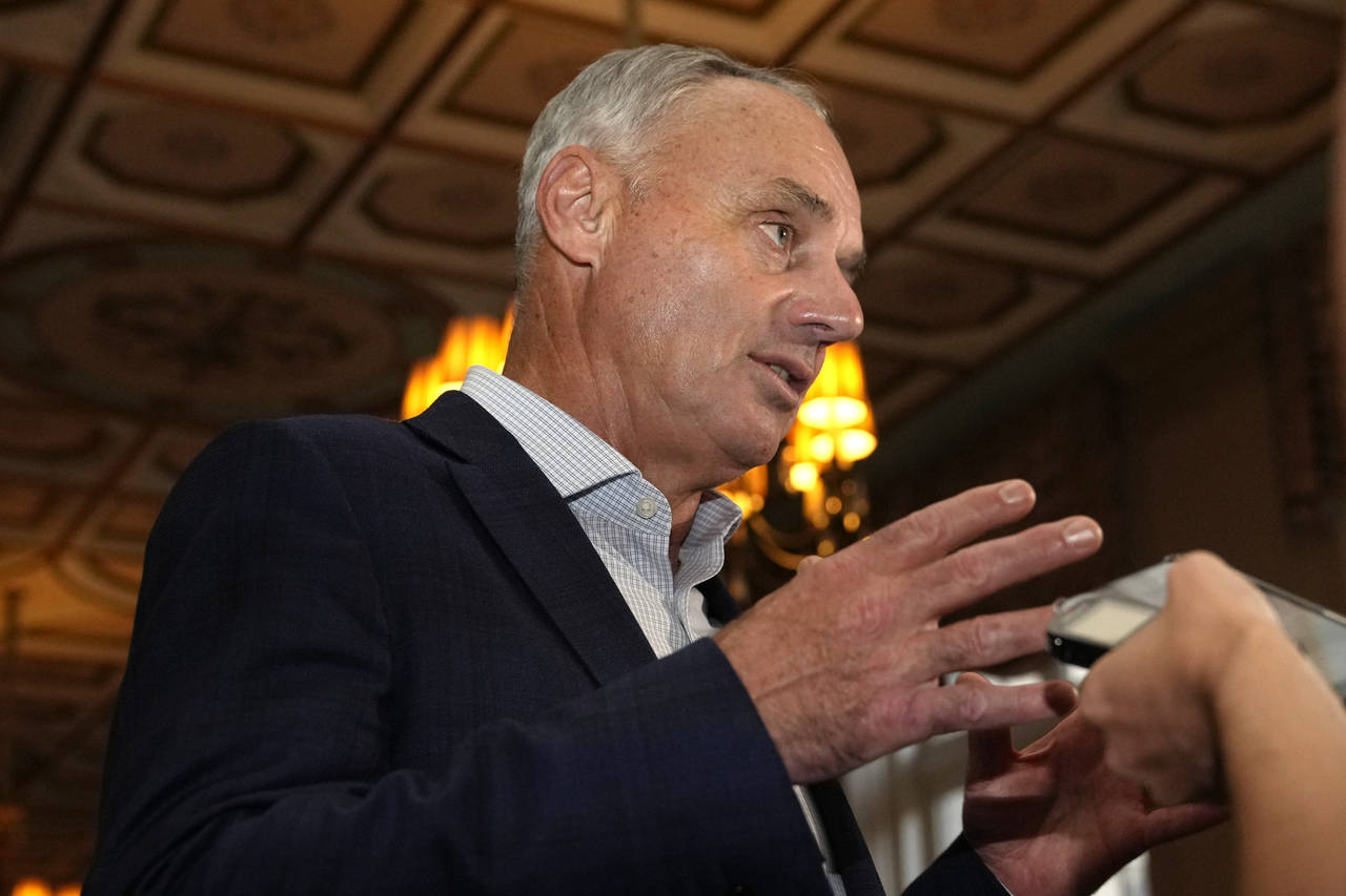 Major League Baseball Commissioner Rob Manfred speaks with the news media after a meeting of MLB ow...