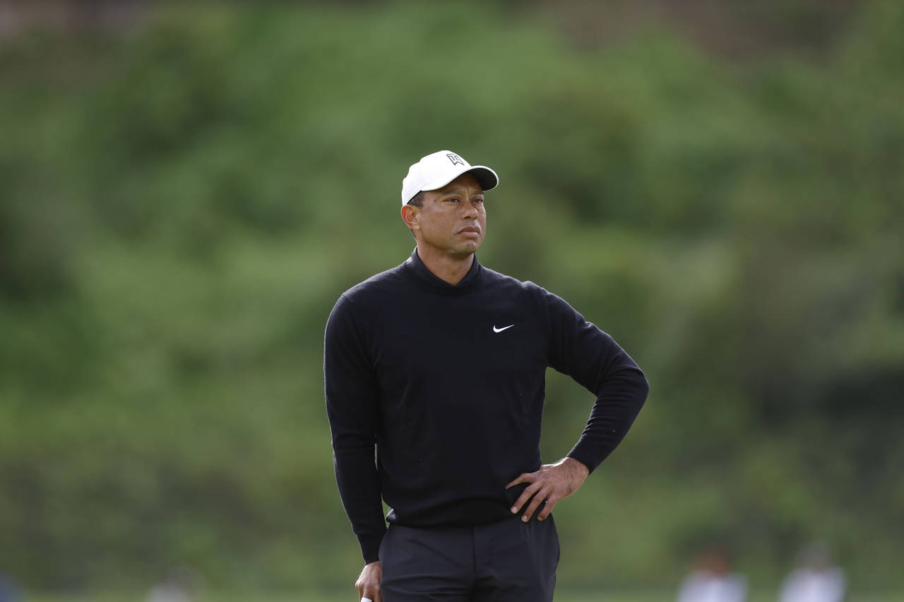 Tiger Woods waits for his turn in play during the second round of the Genesis Invitational golf tou...