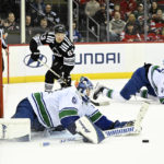 Bratt power-play OT goal gives Devils 5-4 win over Canucks